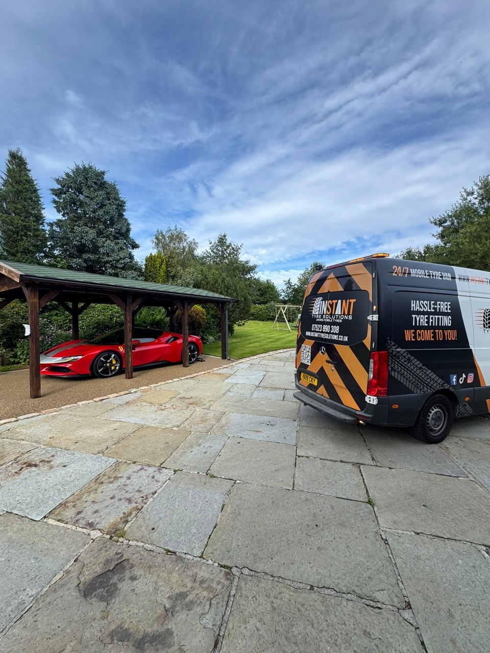 Mobile tyre fitting — residential property with supercar