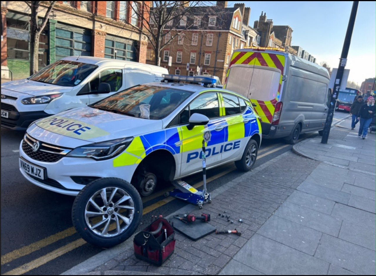 Mobile tyre fitting — police vehicle serviced on street